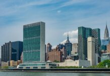 city buildings near body of water during daytime