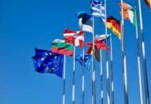 a bunch of flags that are flying in the air