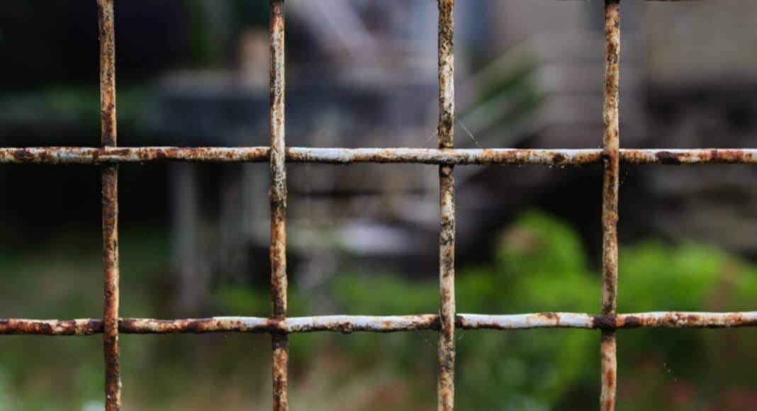 black metal fence during daytime