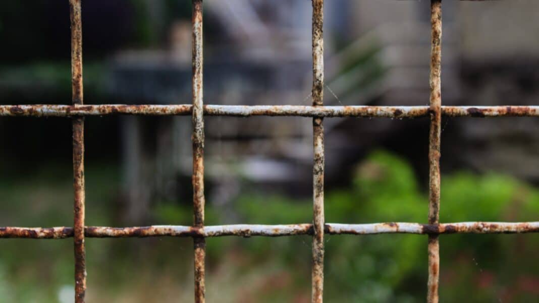 black metal fence during daytime