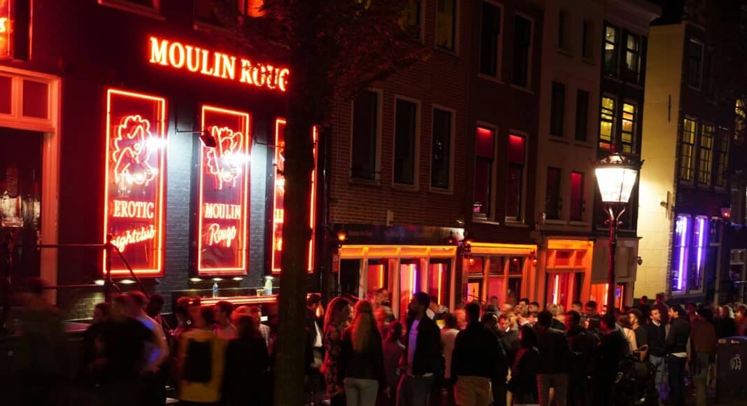 people walking on street during night time