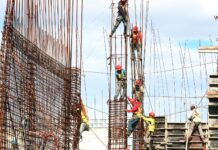 people working on building during daytime