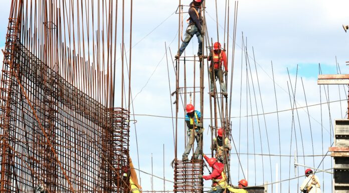 people working on building during daytime