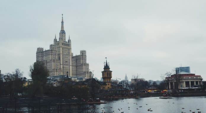photography of cathedral near lake during daytime