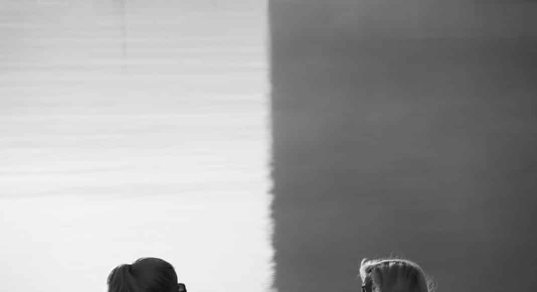 grayscale photo of woman and girl