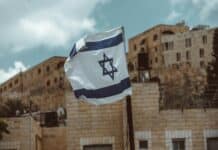 blue and white flag on pole