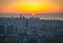 city skyline during sunset with orange sky
