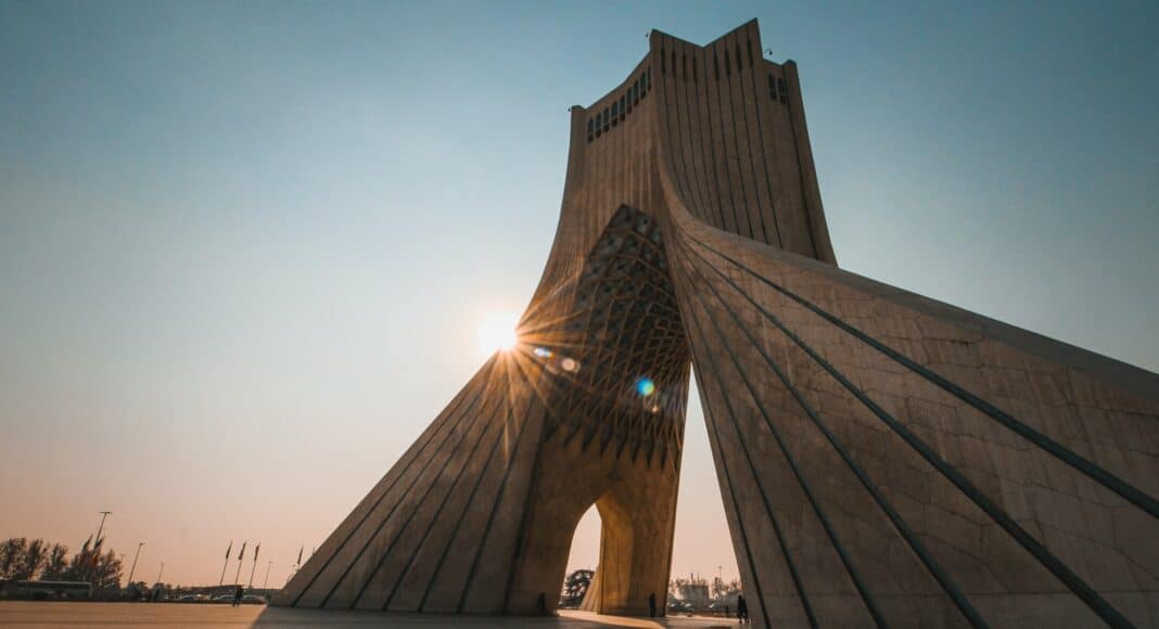 people near brown concrete structures