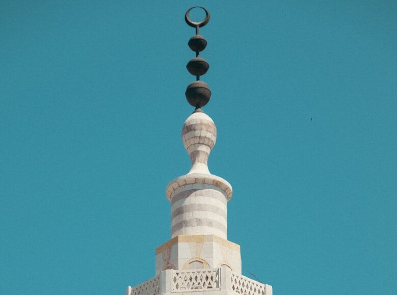 a tall tower with a clock on the top of it