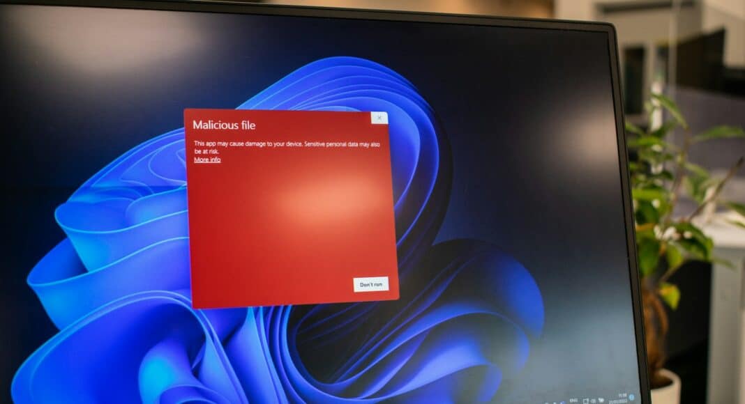 a dell laptop computer with a red screen