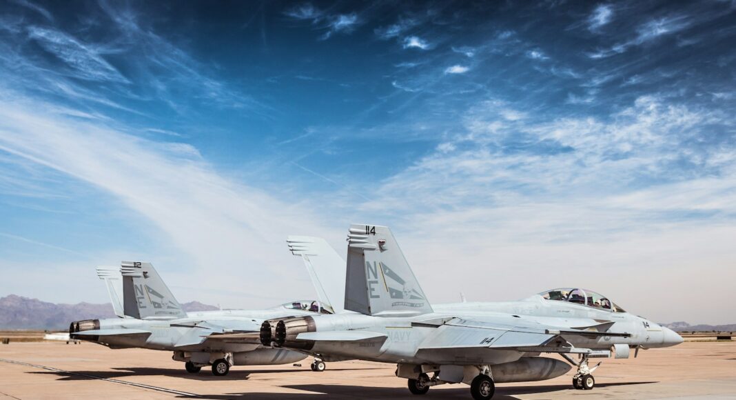 a couple of airplanes on a runway