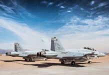a couple of airplanes on a runway