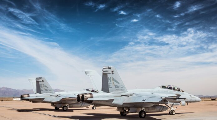 a couple of airplanes on a runway