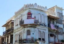 an old building with a balcony and balconies