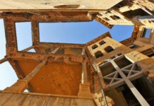 a very old building with a sky in the background