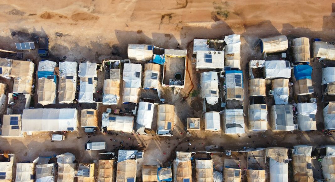 An aerial view of a lot of parked cars