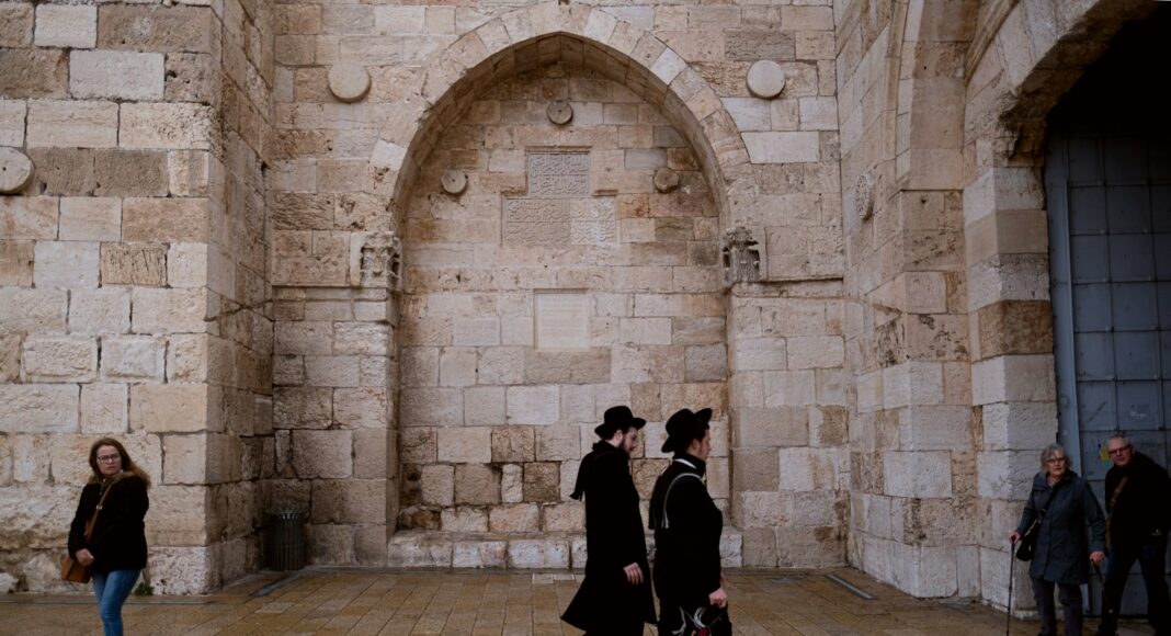 man and woman walking on hallway