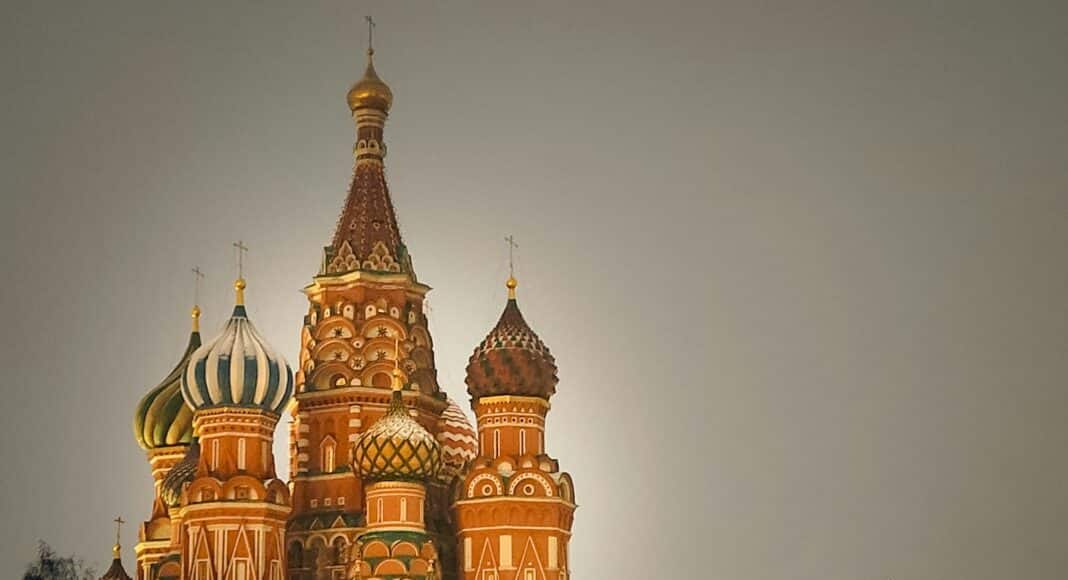 A group of people standing in front of a building