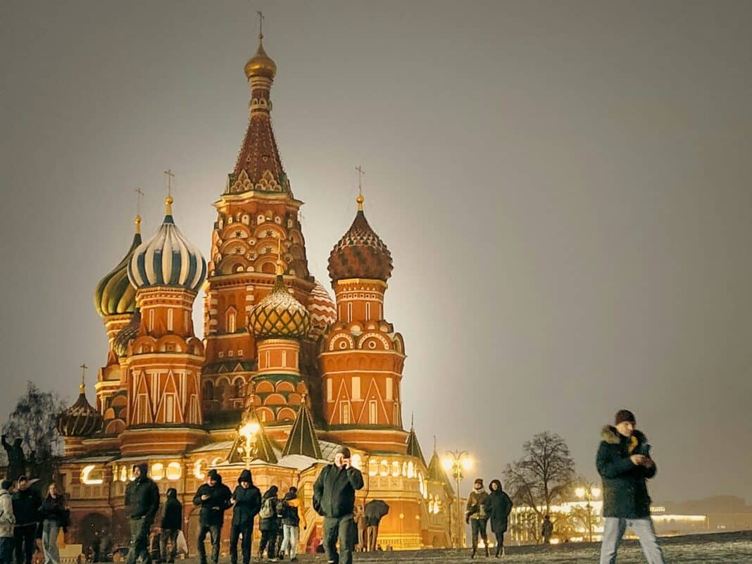 A group of people standing in front of a building