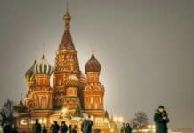 A group of people standing in front of a building