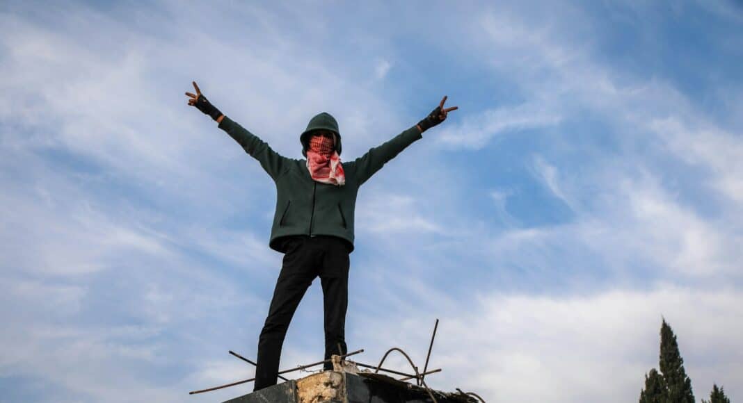 A person standing on top of a building