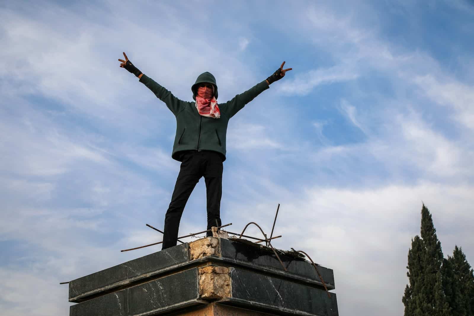 A person standing on top of a building