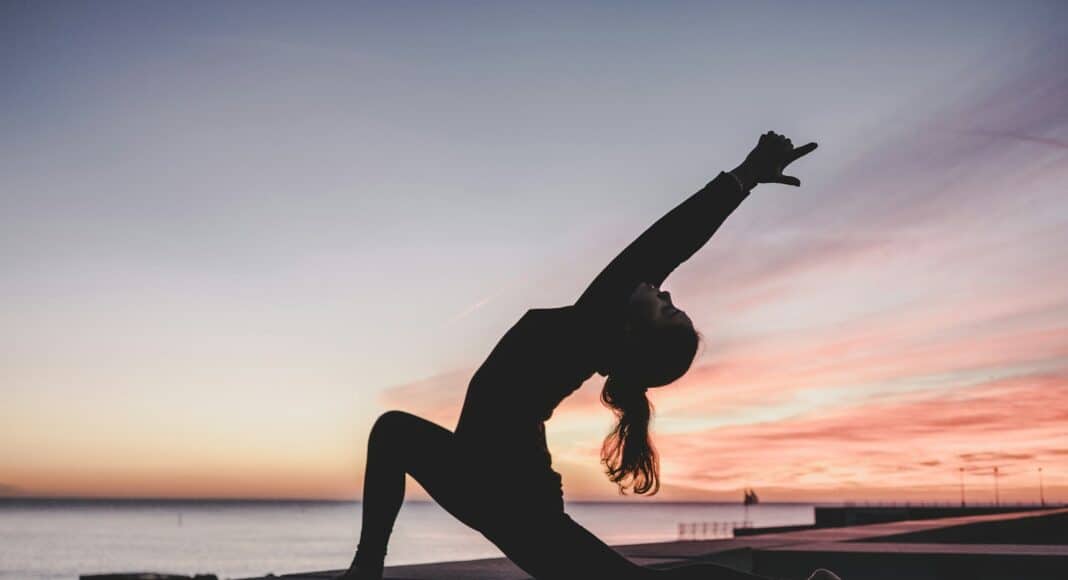 silhouette photography of woman doing yoga