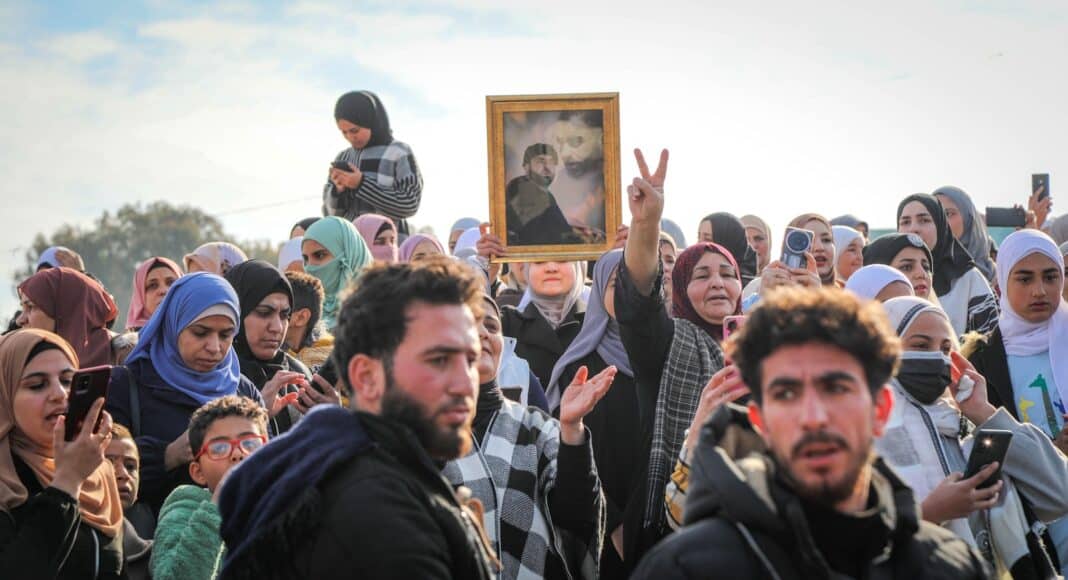 A crowd of people standing around each other