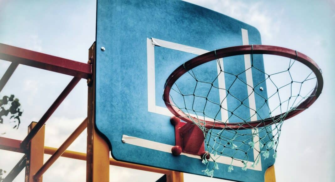 red steel basketball ring mounted or blue wooden basketball board