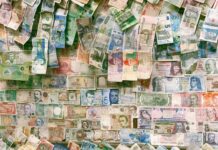 10 and 10 banknotes on brown wooden table