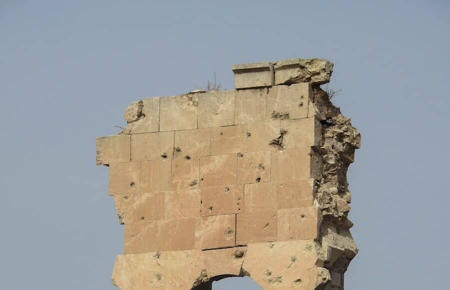 an old building with a clock on the side of it