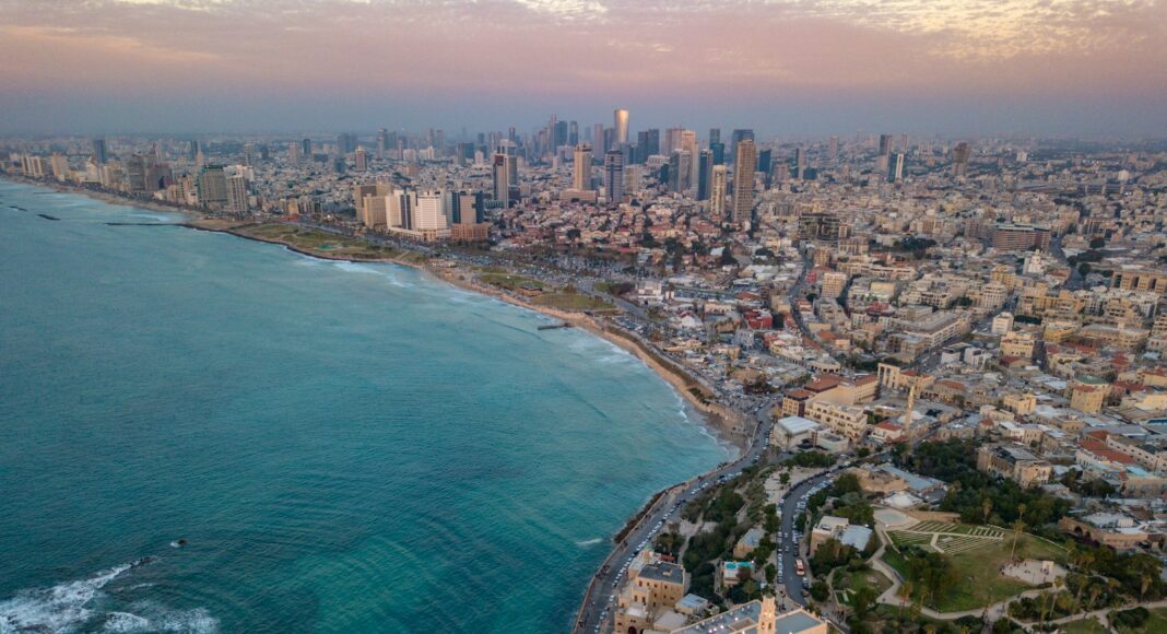 aerial photo of city by the sea