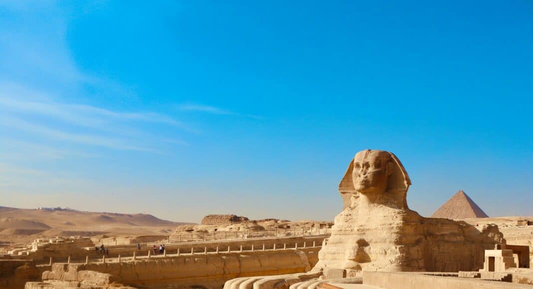 a large sphinx statue in the middle of a desert