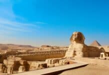 a large sphinx statue in the middle of a desert