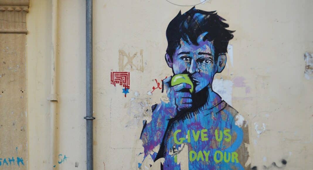 man in blue and green jacket graffiti