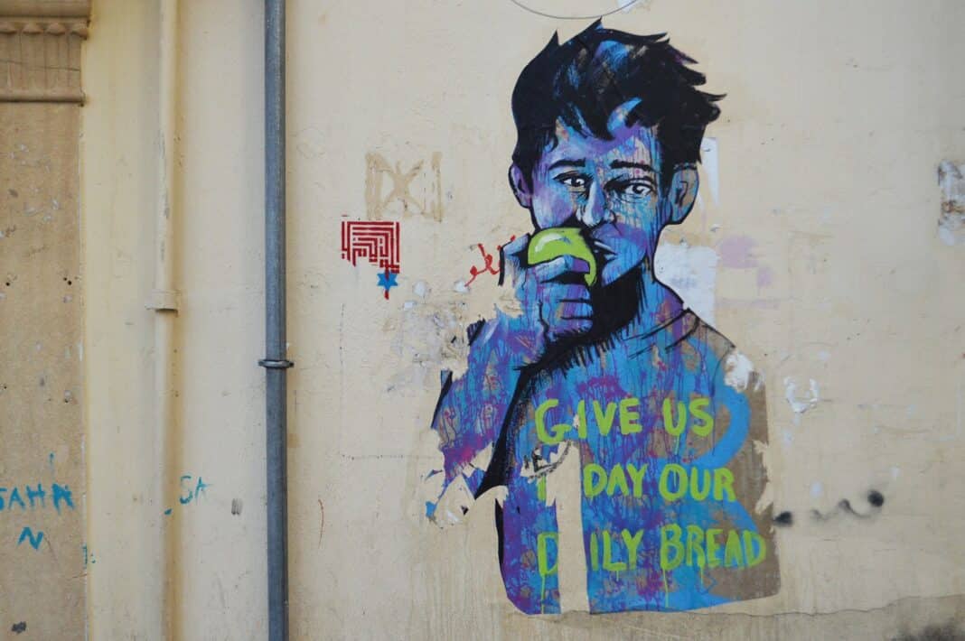 man in blue and green jacket graffiti