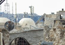 a couple of people that are walking down a street