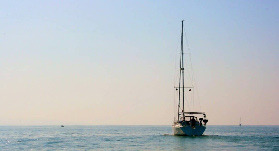 a sailboat in the middle of the ocean