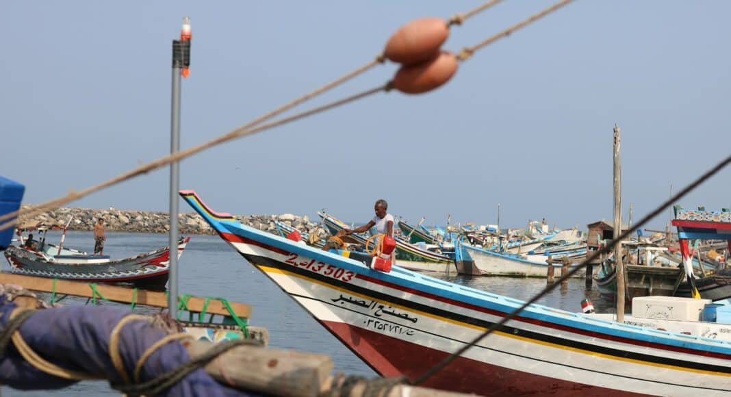 a group of boats that are sitting in the water