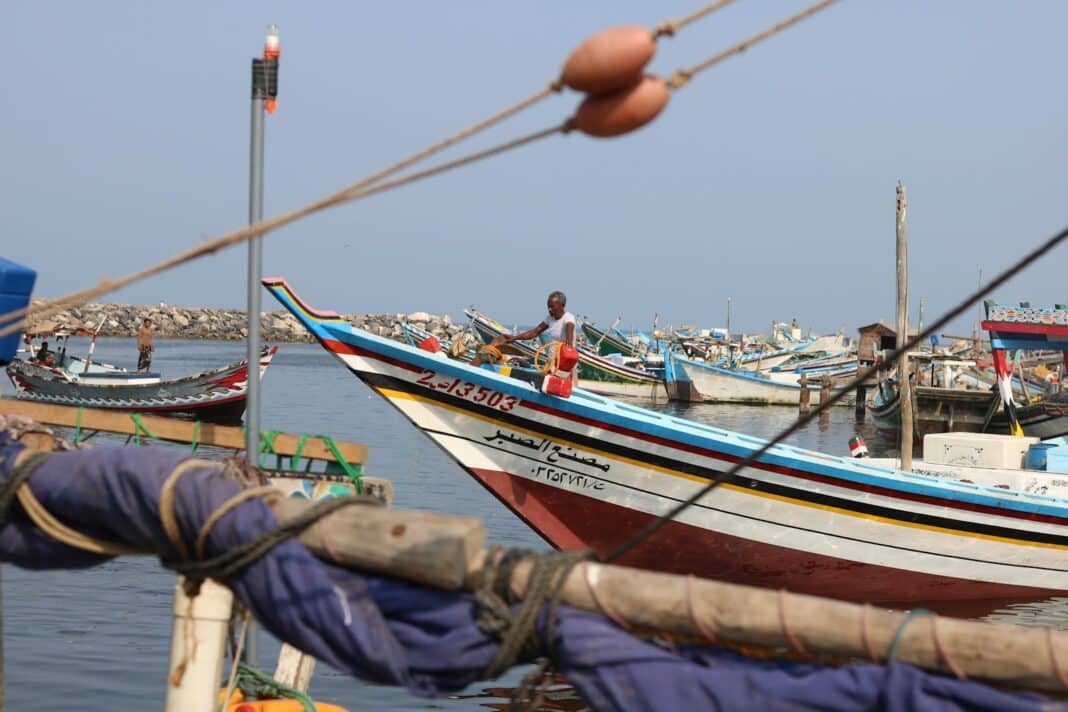 a group of boats that are sitting in the water