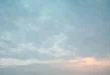 rock on body of water