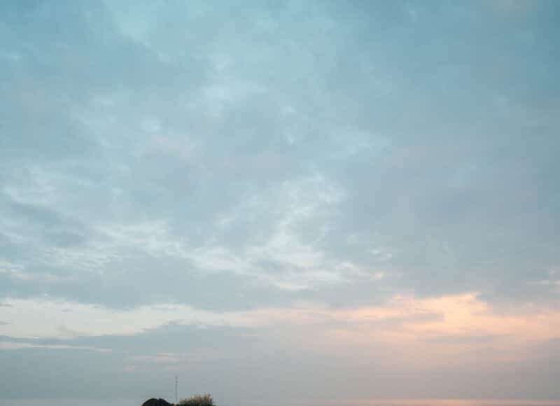 rock on body of water