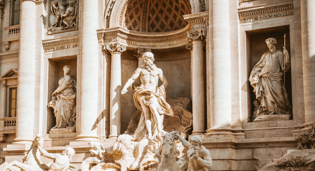 people and horses statue monument at daytime