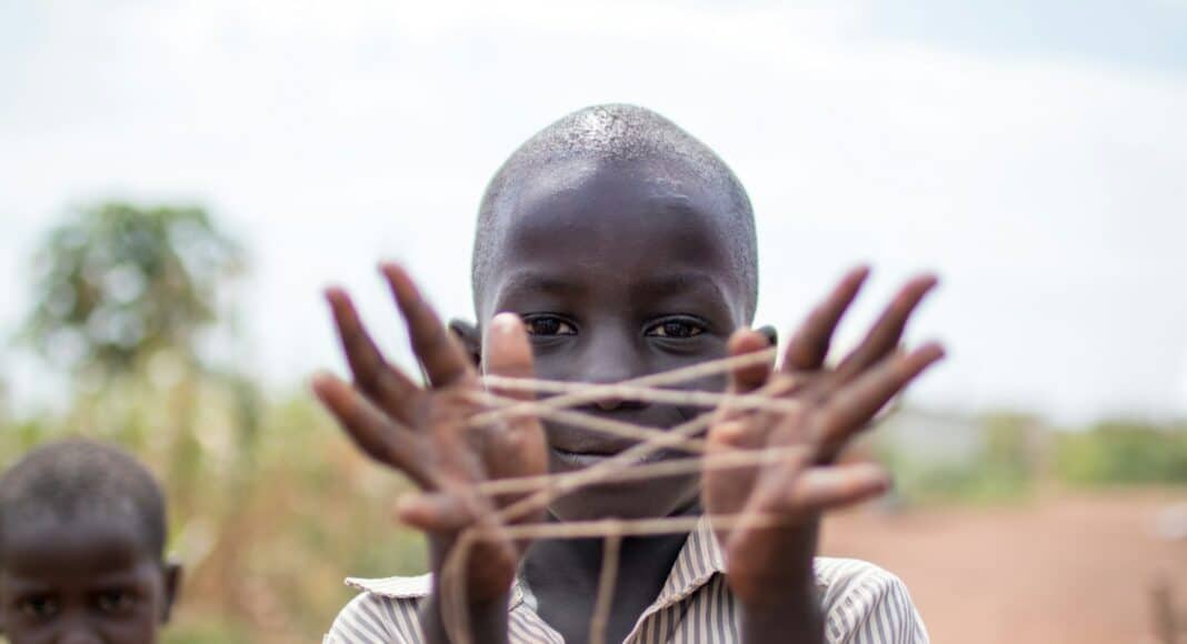 boy showing hand with rubber