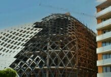 a large building with scaffolding on the side of it
