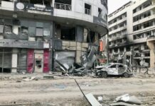 a run down building with a bunch of debris on the ground