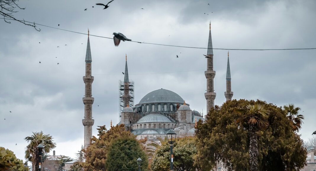 people walking near white concrete building during daytime