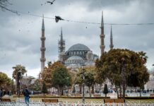 people walking near white concrete building during daytime