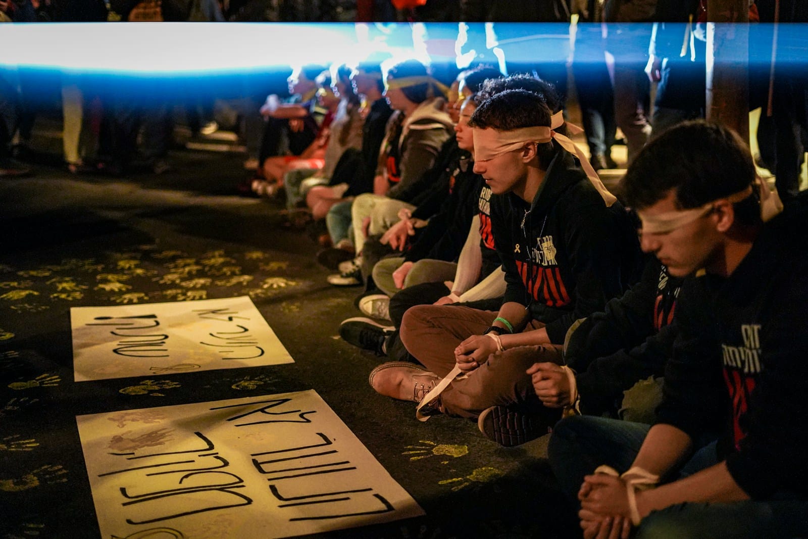 A group of people sitting on the ground