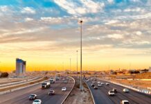 cars on road during sunset